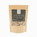 Package of 'Acid Reducer' tea with a beige background