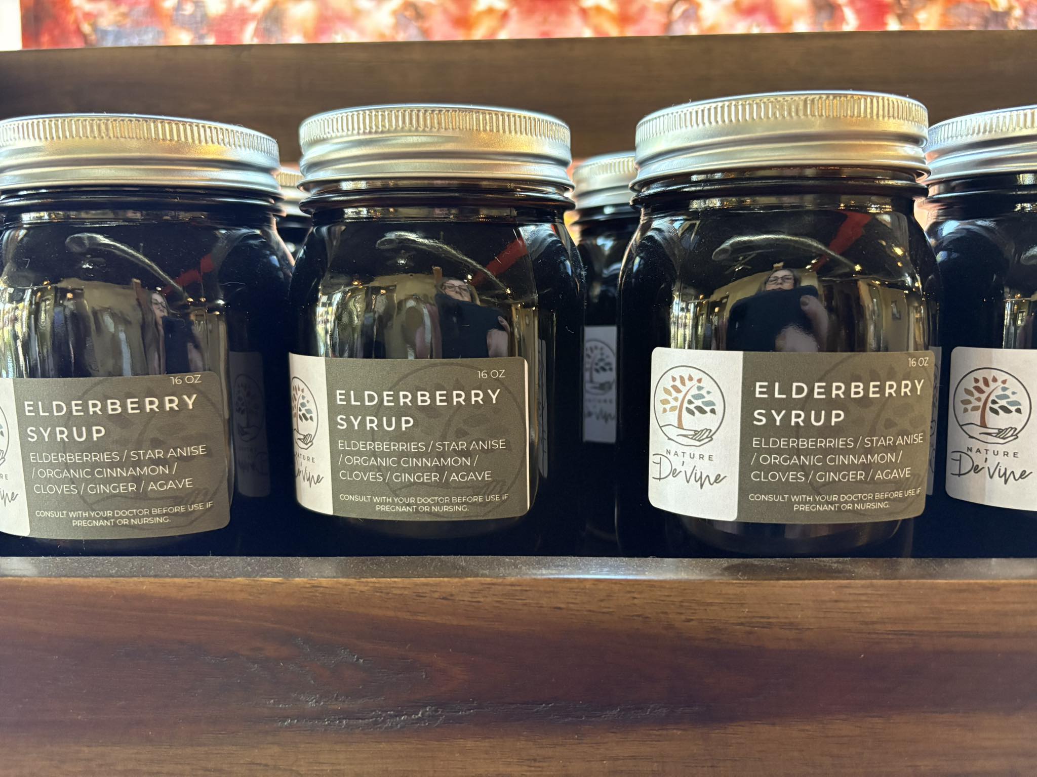 Several jars of Eldererry Syrup on shelf