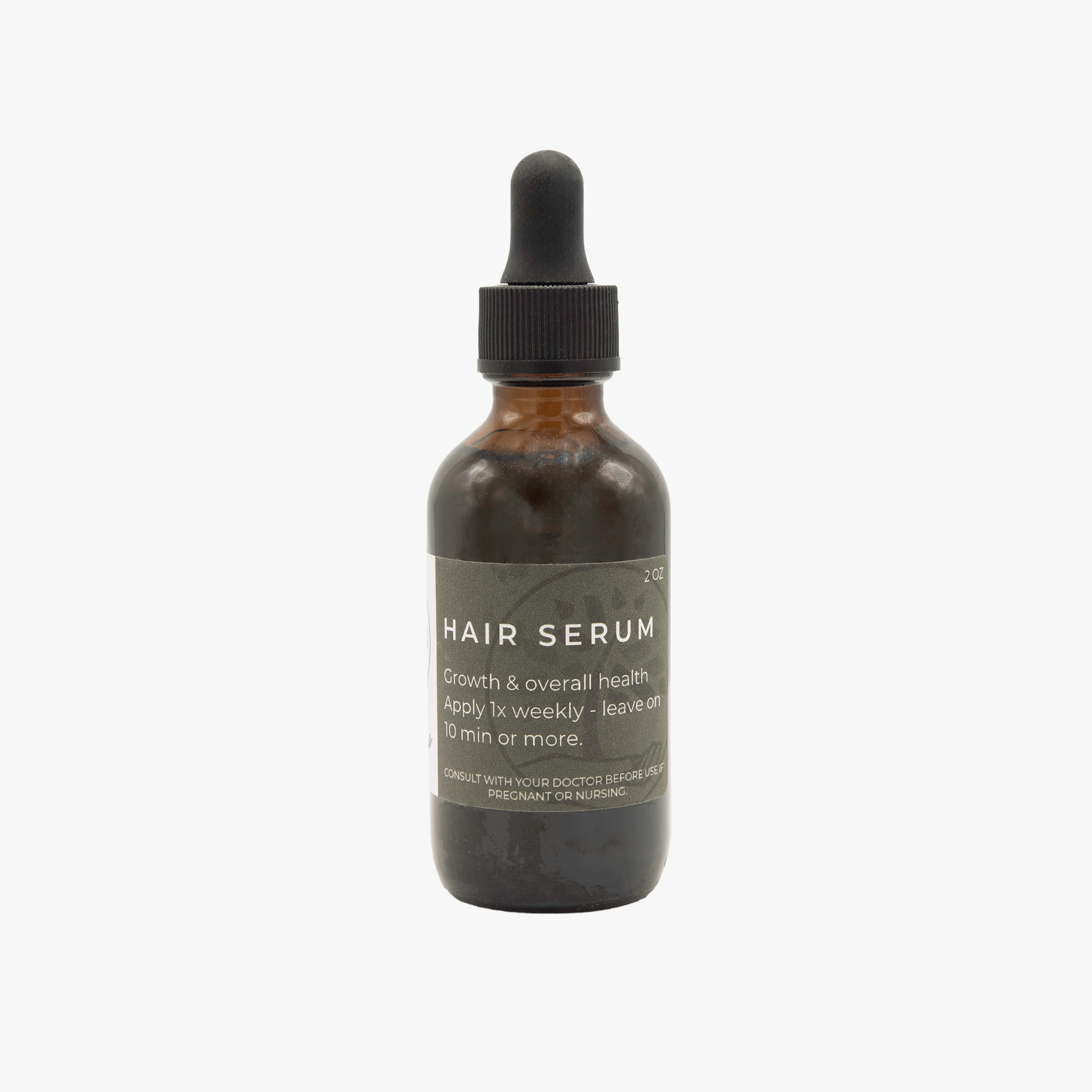 Hair serum bottle with dropper on a white background